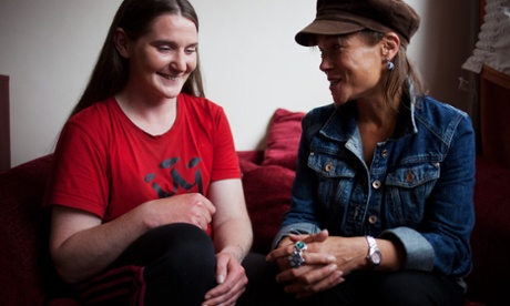 Cathy Teesdale and Naiomi share a laugh on a couch, London