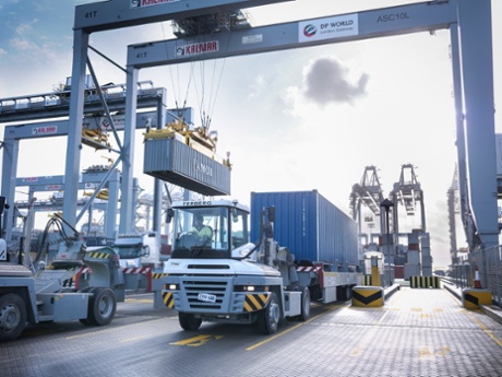 An automated stacking crane and terminal tractor at London Gateway.