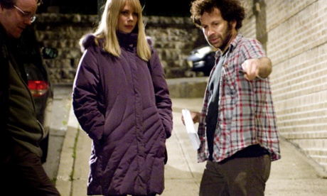 Kaufman (right) with Philip Seymour Hoffman (far left) and Michelle Williams during the making of Synecdoche, New York.