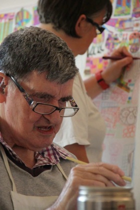 Michelle Roberts and Albert Geere at work.