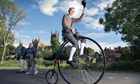 Dave Preece on his Penny Farthing lifting his cap