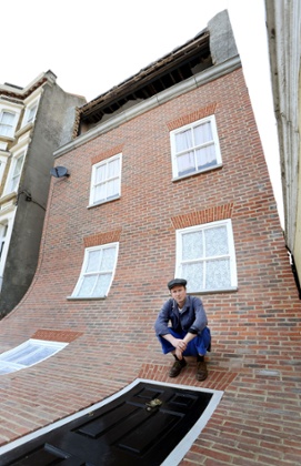 Alex Chinneck at the property on Godwin Road, Margate, in 2013, where he peeled the front off in a project called From the Knees of My Nose to the Belly of Toes.