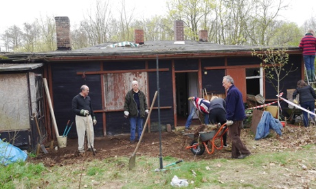 Clean-up day in April 2014 with Thomas's father Frank pushing a wheelbarrow.