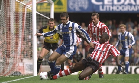 Eric Cantona is tackled by Ulrich van Gobbel. United lost 6-3.