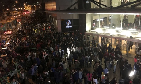 People evacuate a mall in Santiago after a powerful earthquake, in Santiago, Chile, Wednesday, Sept. 16, 2015.