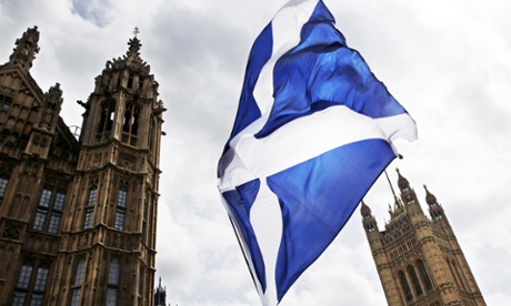 A giant Scottish Saltire flag outside the Houses of Parliament shortly before Scotland First Minister Nicola Sturgeon posed with newly-elected Scottish National Party (SNP) MPs during a photocall in London on May 11, 2015.