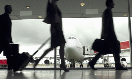People walking through an airport