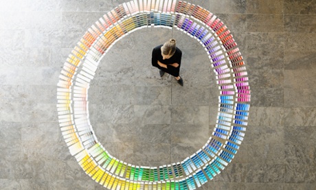 Businesswoman examining paint swatches
