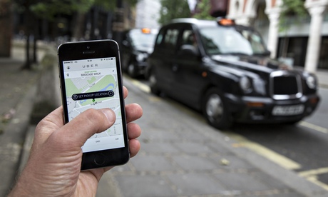 An Uber user ignores a black-taxi rank in favour of the phone app