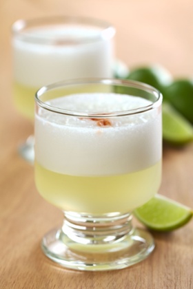 Peruvian cocktail called Pisco sour, made of Pisco, lime juice, syrup and egg white. Cheers!