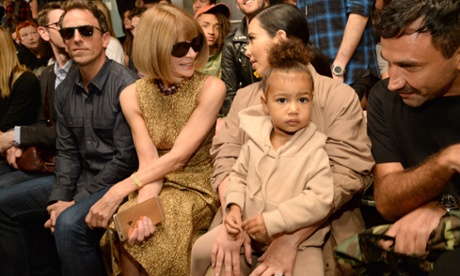 North West sits on Kim Kardashian's lap as her mother chats to Anna Wintour during Kanye West's fashion show this week