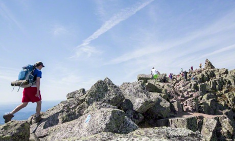Hikers on the Knife Edge Trail to Baxter Peak of Mount Katahdin, the northern terminus of the Appalachian Trail.