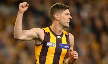 Luke Breust kicks one of his four first-half goals for the Hawks