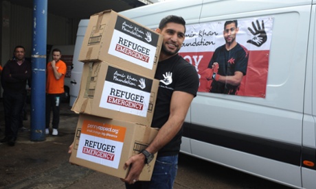 Khan helping staff and volunteers from the Amir Khan Foundation load the convoy bound for Lesbos that departed Bolton earlier this week.