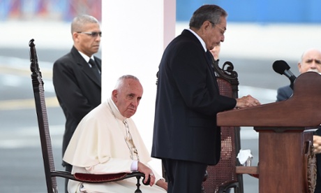 Pope Francis listens to Cuban President Raul Castro delivering a speech