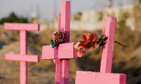 Pink wooden crosses murdered women Mexico.