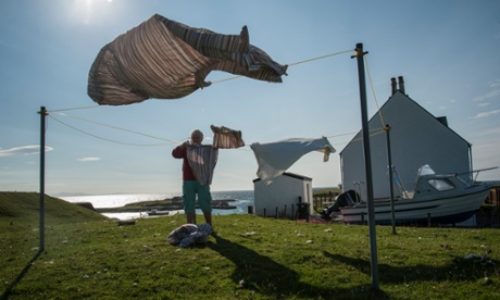 Blown away: a local gets the washing out.