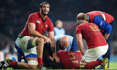 France's Yoann Huget is comforted by team-mates after tearing his cruciate ligament against Italy at Twickenham.