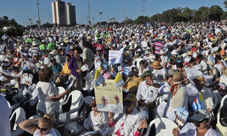 People wait for the arrival of Pope Francis