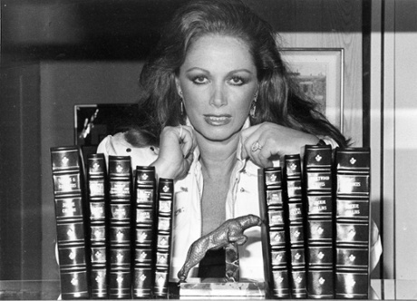 ‘She mocked the earnest women’s fiction of the 60s’ … Jackie Collins with her books and trademark panther.