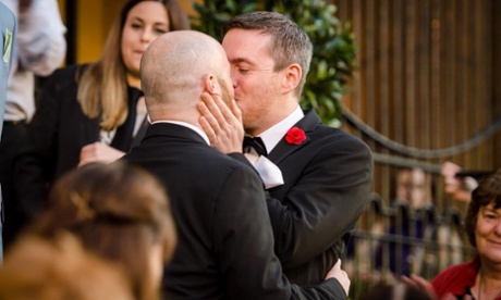 Malachai O'Hara (left) and Michael McCartan say their wedding vows before a crowd of hundreds in Belfast