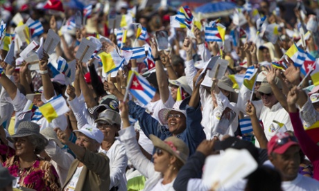 Thousands greet Pope Francis as he arrives to celebrate Mass at the Plaza of the Revolution in Holguin.