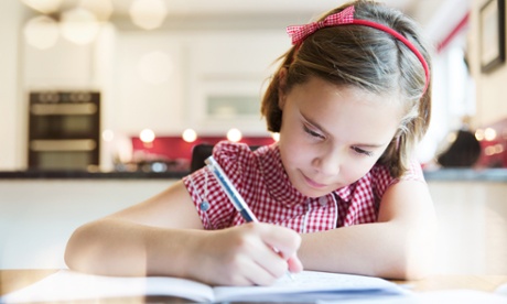 Girl writing in kitchen