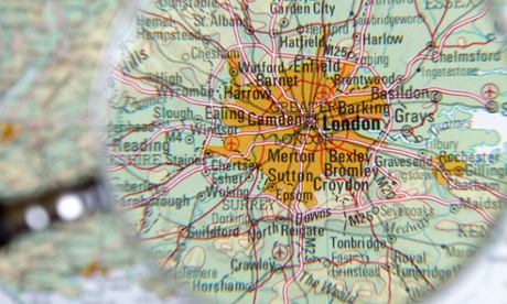 Magnifying glass hovering over a map of London
