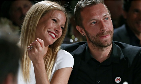 Gwyneth Paltrow grinning next to a smiling Chris Martin
