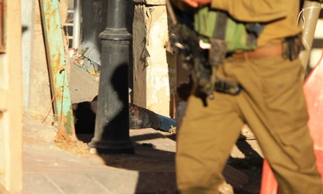 The body of Hadeek al-Hashlamon lies on the ground after being fatally wounded by gunfire by Israeli soldiers who initially said she had been shot in the legs. 