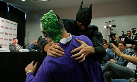 Tyson Fury wrestles The Joker during his press confernce with Wladimir Klitschko.