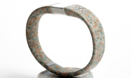 The Worldbeing wristband seen balanced on a stand