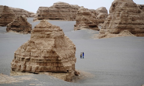 Tourists in the Yadan national geological park in the Gobi desert, China