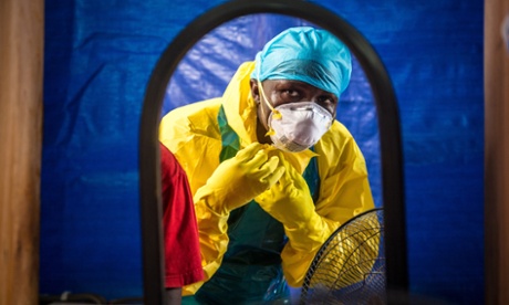 A healthcare worker dons protective gear before entering an Ebola treatment centre in Sierra Leone. The outbreak of the disease highlighted the need for better investment in science.