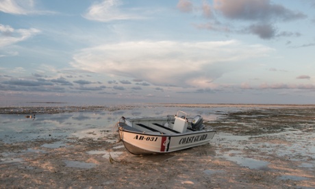 A coastguard boat at low tide in Tubbataha marine park in the Philippines
