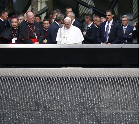 Pope Francis praying at the pools of the 9/11 memorial.
