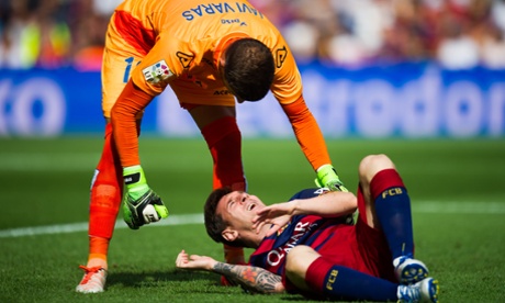 Lionel Messi is helped by the Las Palmas goalkeeper, Javi Varas, after the Argentinian forward damaged knee ligaments in Barcelona's victory.