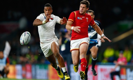 Rugby World Cup: Lloyd Williams of Wales and Anthony Watson of England chase the ball