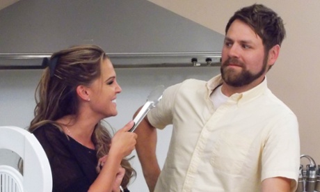 Tong in cheek… Danielle Lloyd in her kitchen with Brian McFaddon.