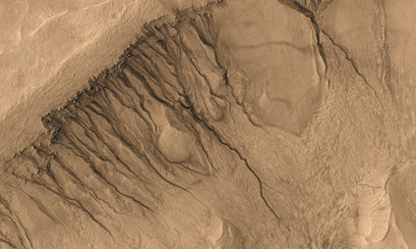 Dark streaks on the side of Newton basin on Mars.