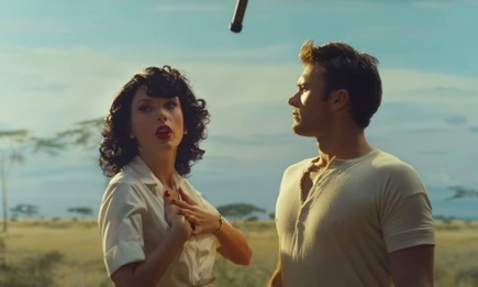 Taylor Swift and Scott Eastwood are dressed in fifties clothing against the backdrop of savannah grasslands for her video Wildest Dreams