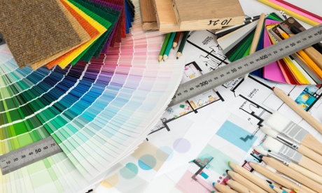 Picture of room decorating equipment, including colour chart and paint brushes.