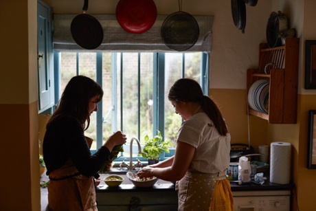 Sophie (left) and Caroline preparing a quick supper.