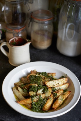 Caroline and Sophie 's potato wedges with green dressing and tomato salsa.
