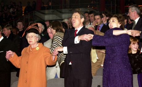 The Queen joins then prime minister Tony Blair and wife Cherie, singing Auld Lang Syne, during midnight celebrations to see in the millennium.