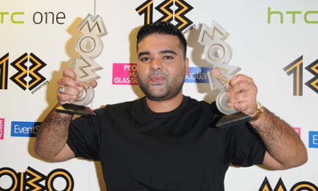 Naughty Boy shows off his best song award for La, La, La, and best video gong at the Mobos in 2013.