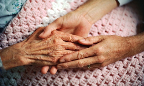 Holding Hands with Elderly Patient