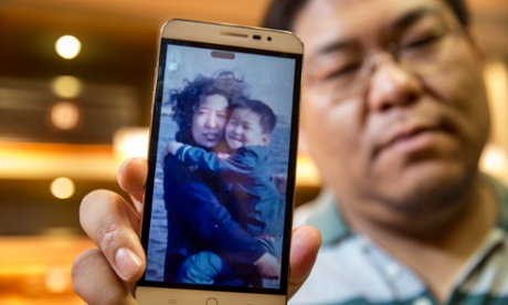 Wang Dan with a picture of his mother