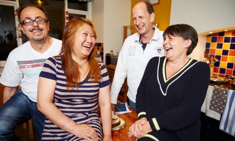 Jane and Paul Roper (right) at home in south Manchester with their guests Reza Zobdeh (far left) and his wife Guiying Zu