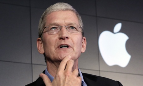 Apple CEO Tim Cook responds to a question during a news conference